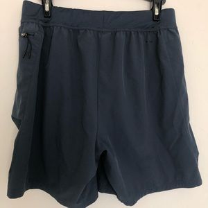 Blue athletic gym/running shorts. Hits above the knees. Size medium